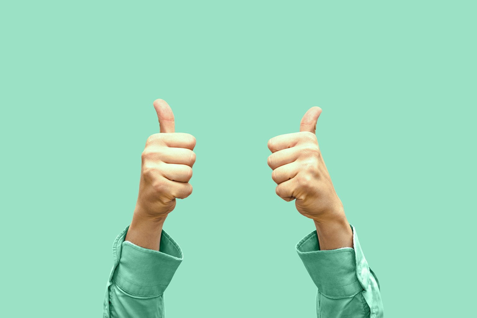 View of two hands with thumbs up