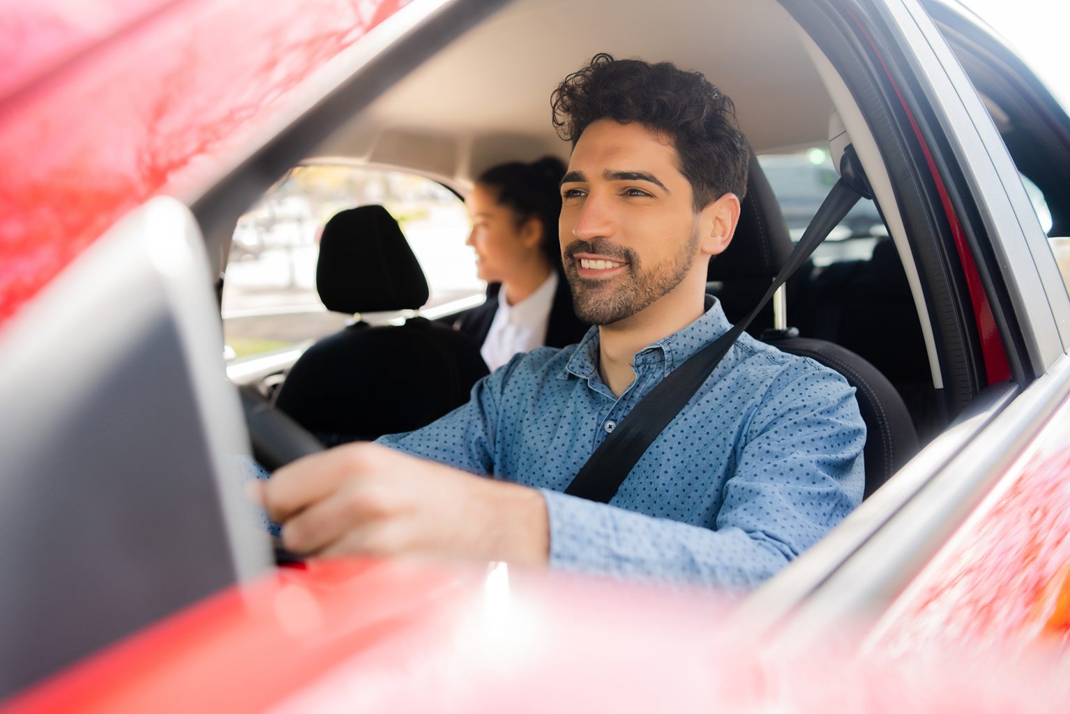 Ride share driver with passenger in the back seat