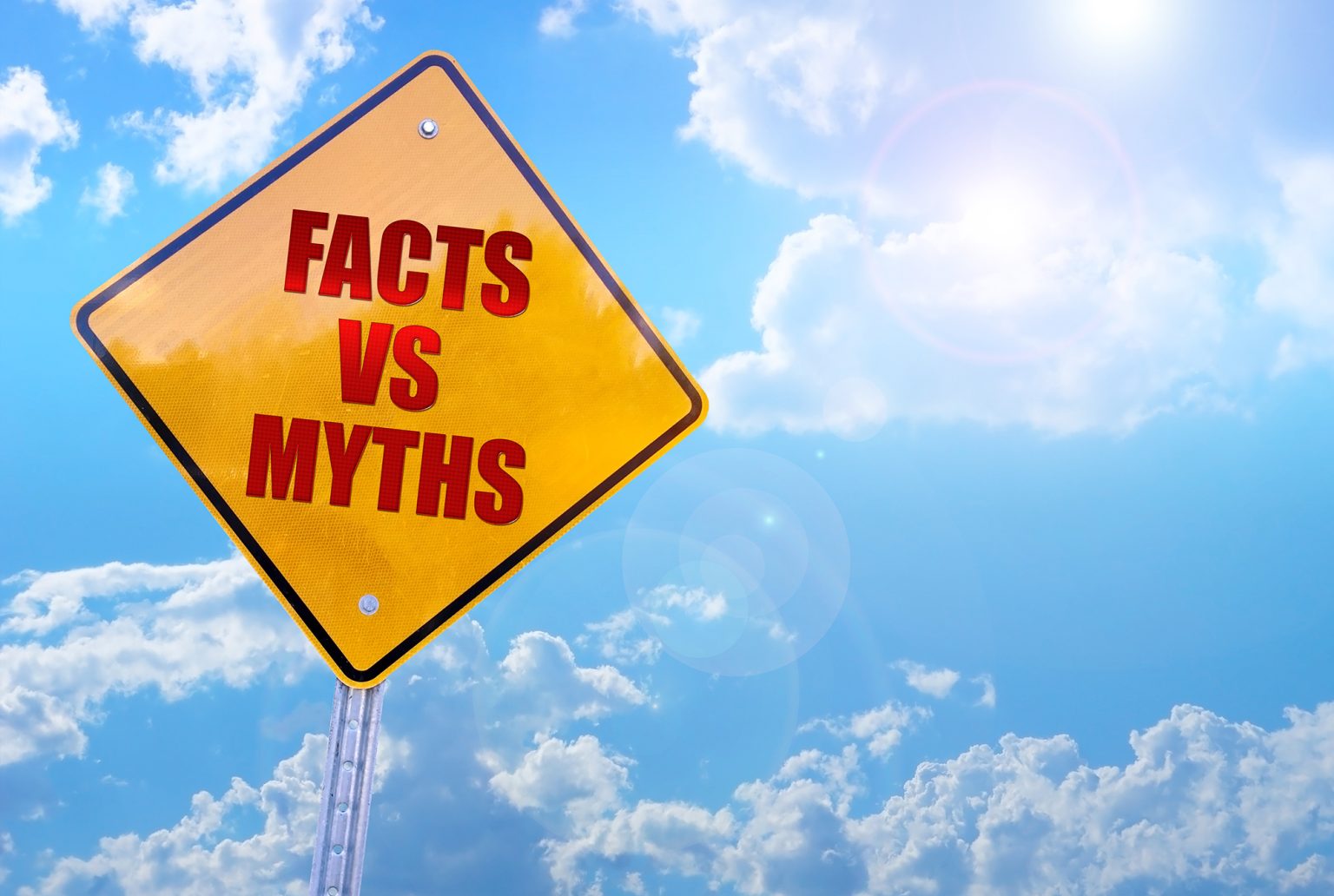 facts vs myths word on yellow traffic sign blue sky background