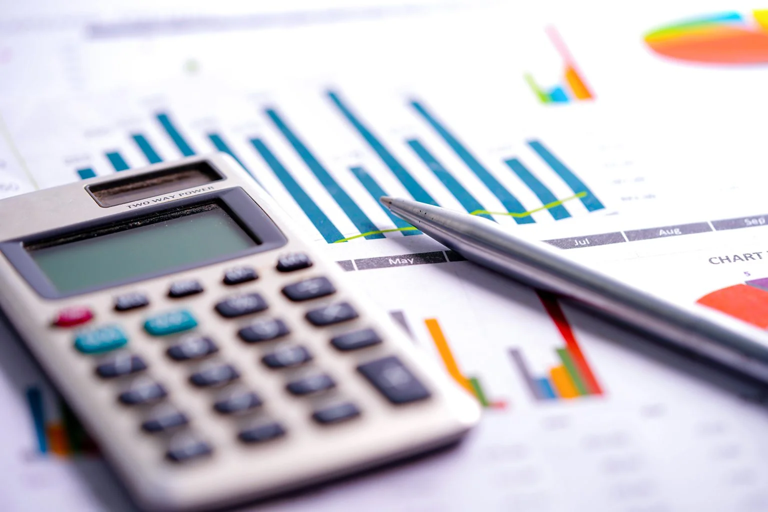 Calculator on chart and graph spreadsheet paper