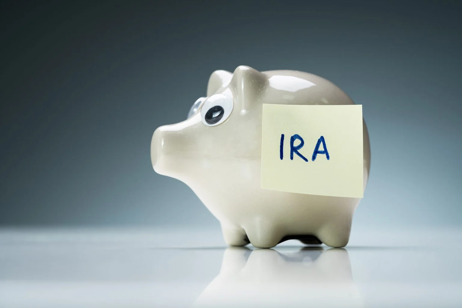 Piggy bank with a post-it note that says IRA
