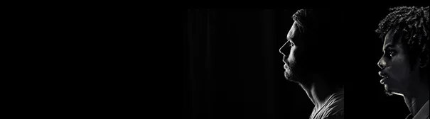 Silhouette of white and black man