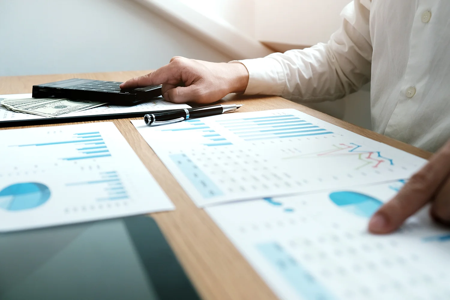 women checking annual financial statements of company