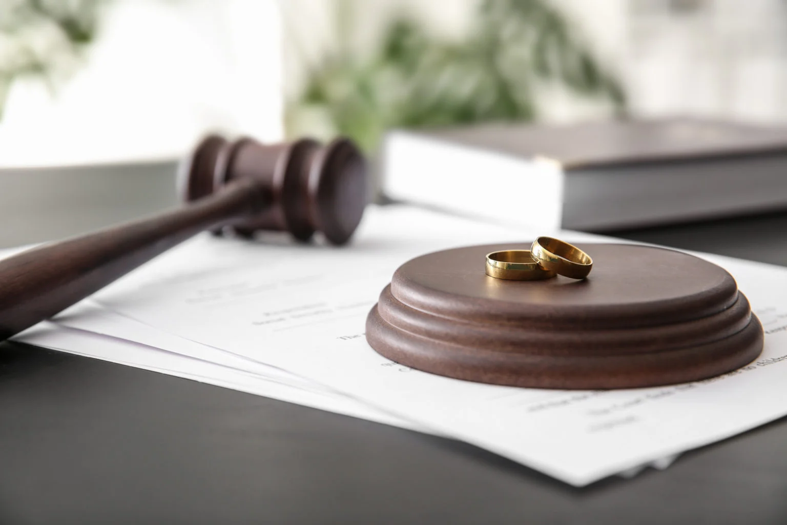 Wedding rings on a gavel stand