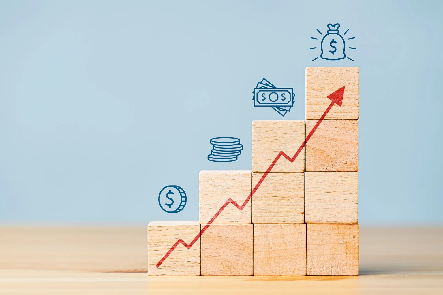 Block with an arrow pointing up and different money graphics