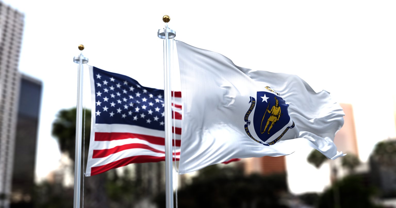 Massachusetts state flag in front of the American flag