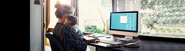 Mom and baby at a computer