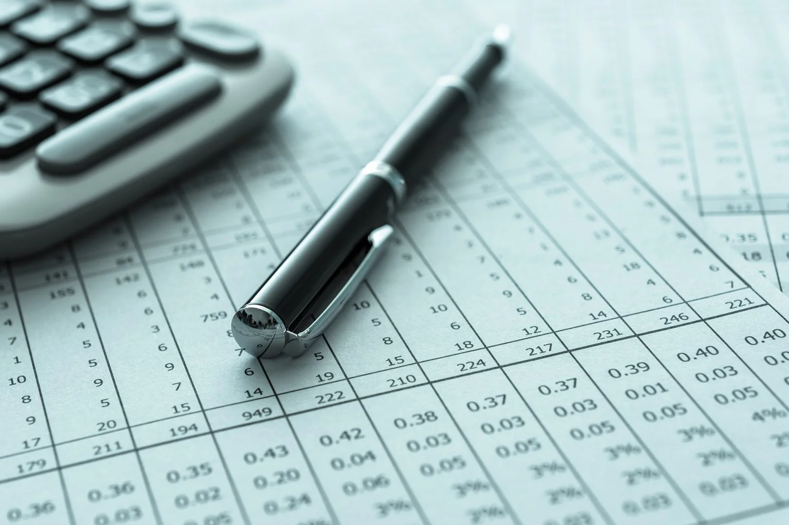 Accounting book with calculator and pen