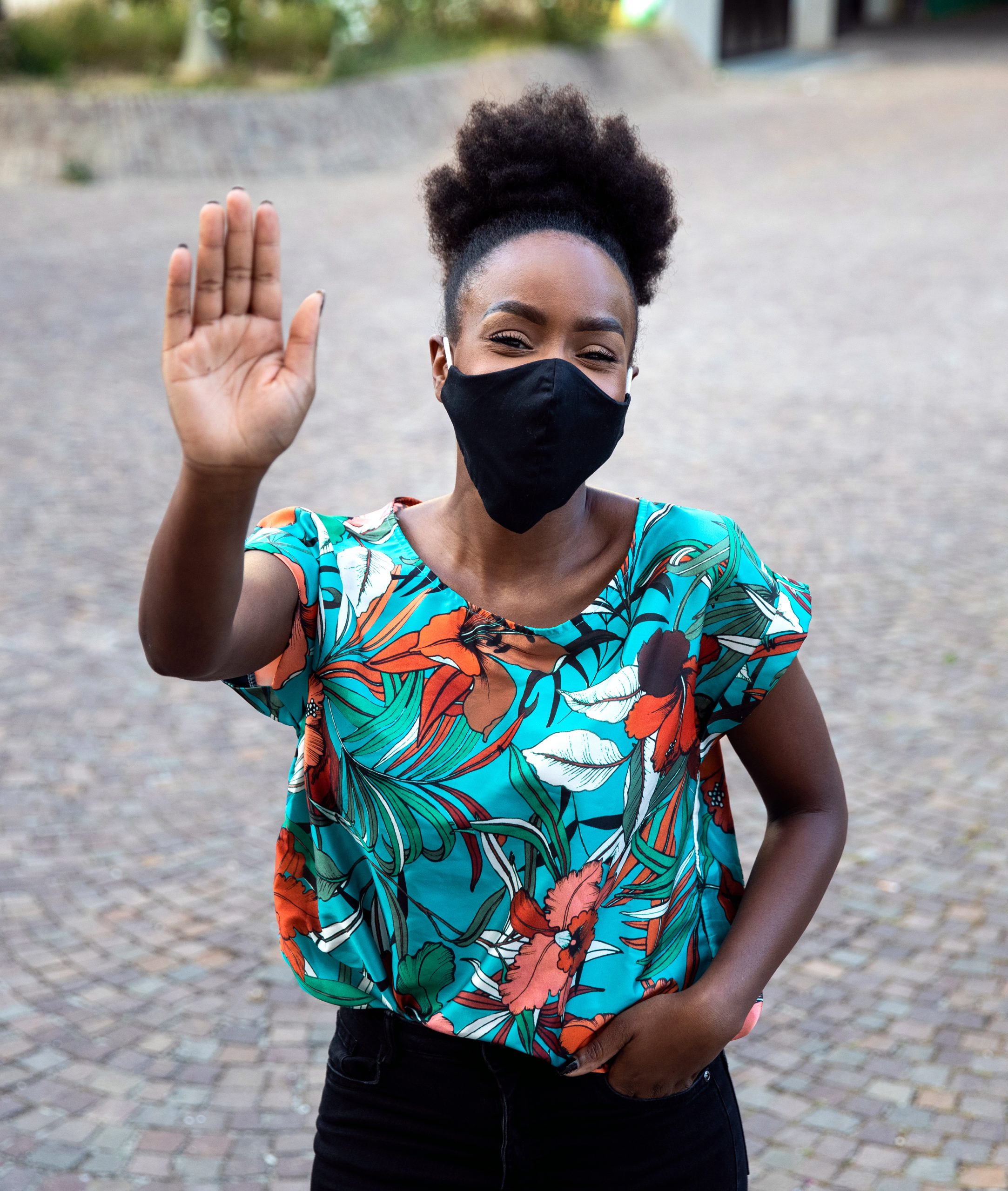 Woman waving to a friend