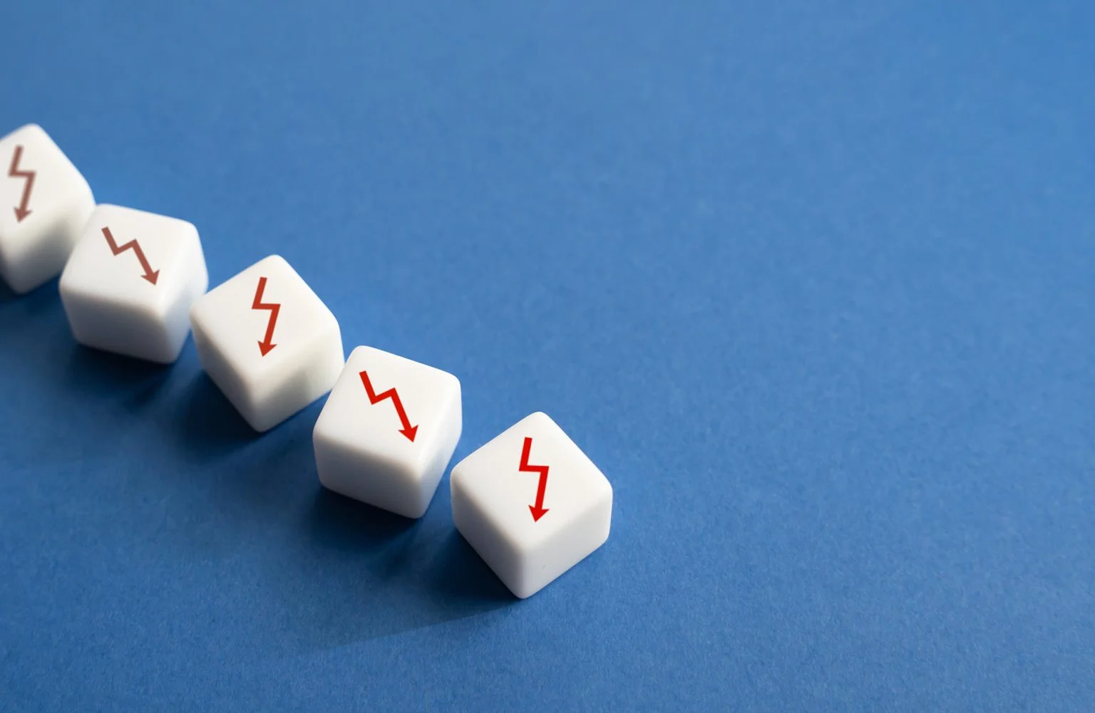 White blocks with arrows pointing down on a blue background