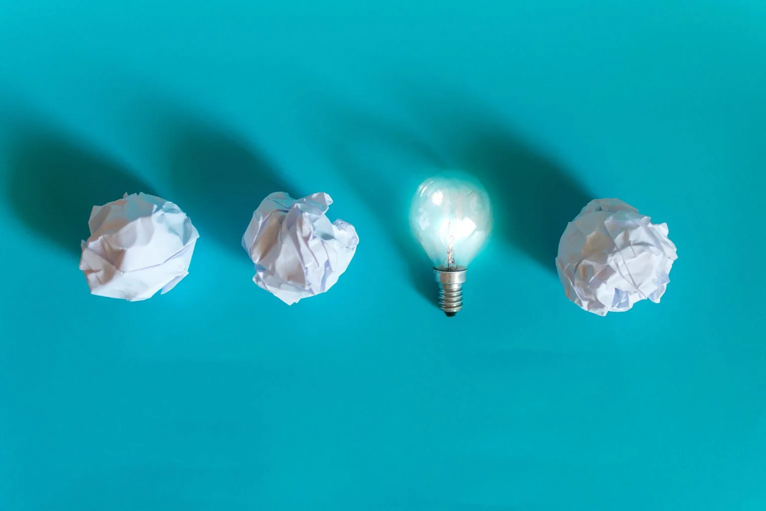 Concept of bright idea with paper and light bulbs