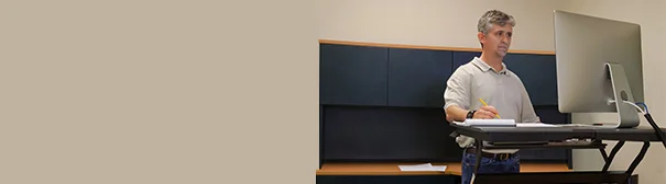 Man using stand up desk