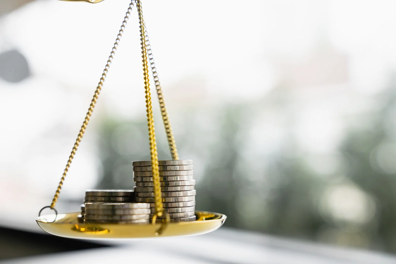 Coins stack with balance scale