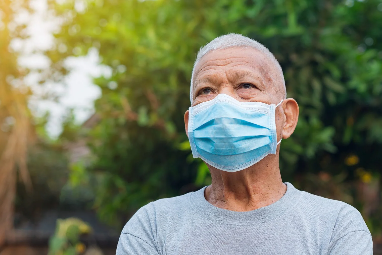 elderly man with short white hair, wearing face mask