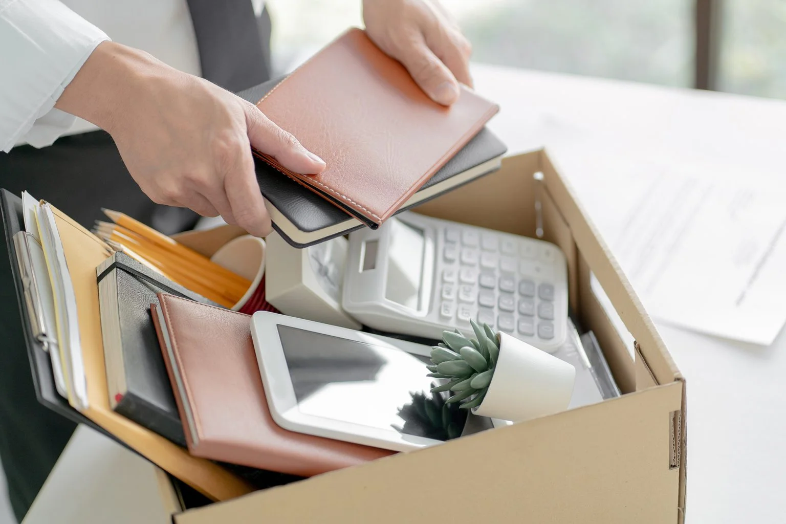 Businessman putting belongings in a box at work