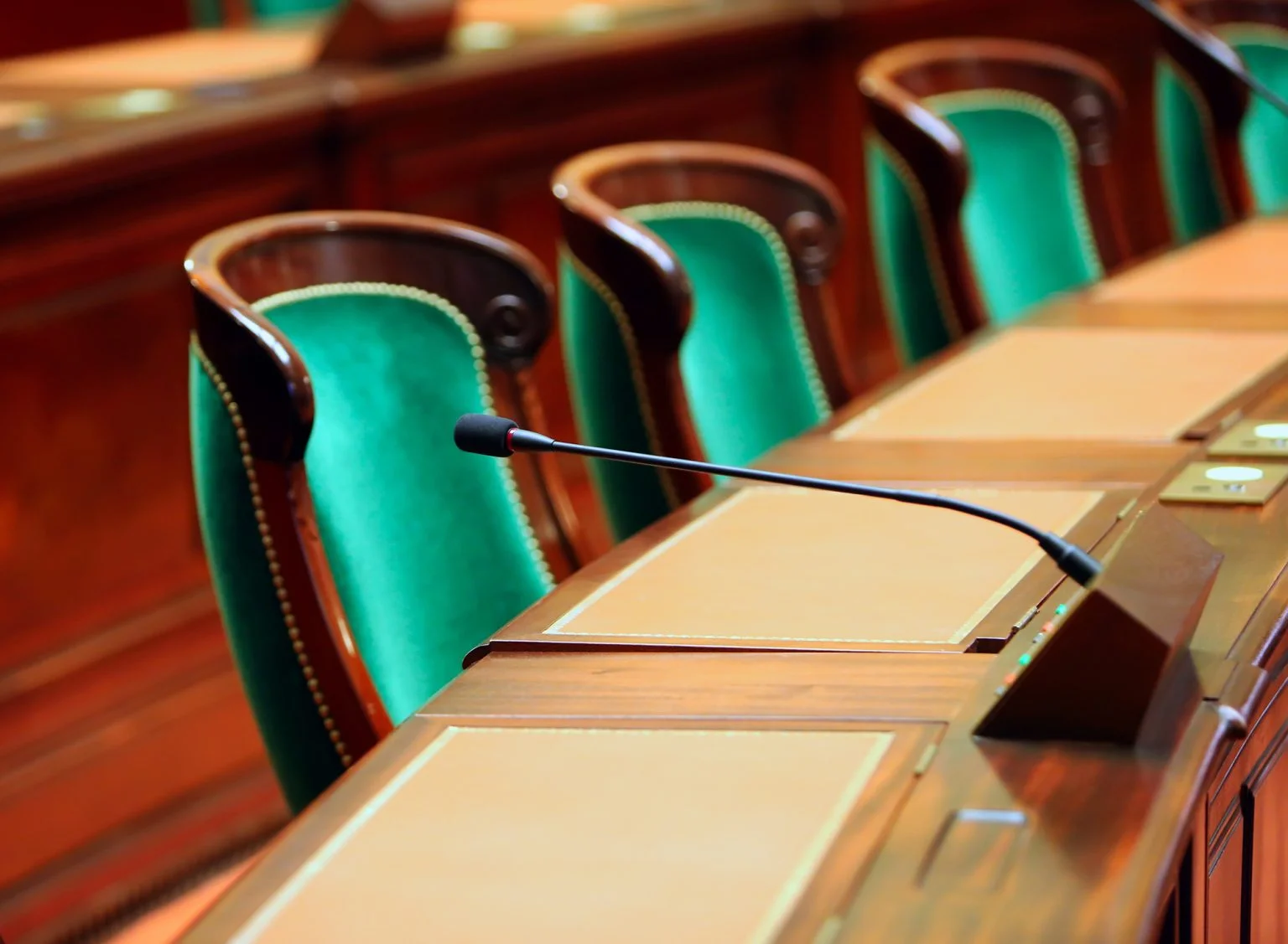 Empty vintage congress hall with seats and microphones