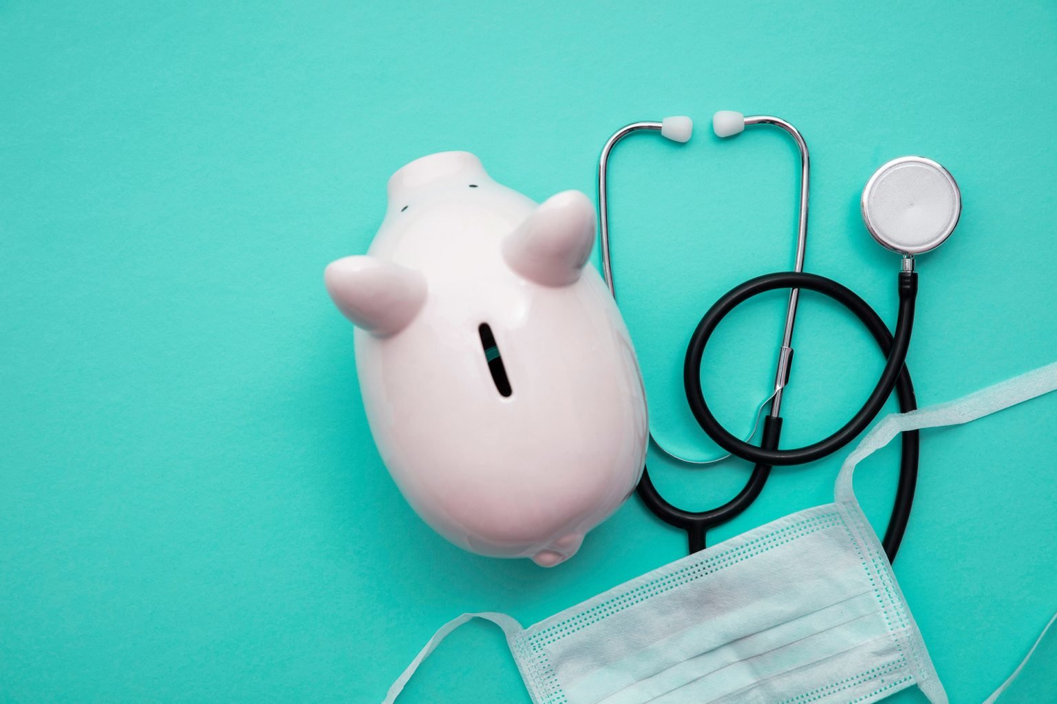 Piggy bank with a medical doctors stethoscope