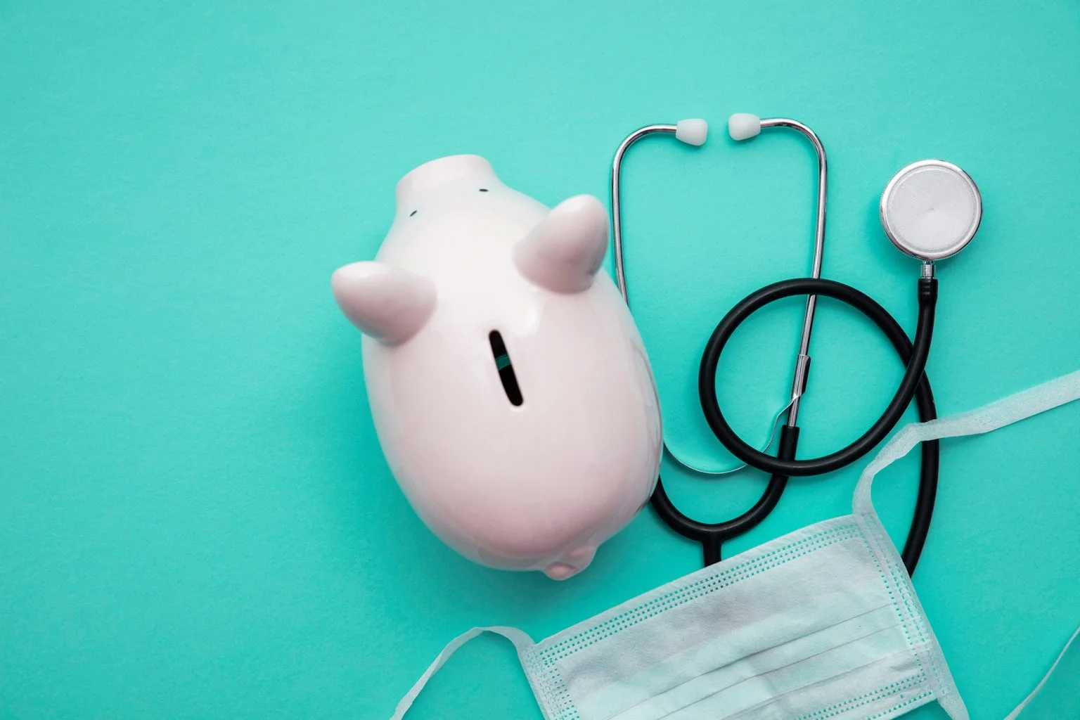 Piggy bank with a medical doctors stethoscope