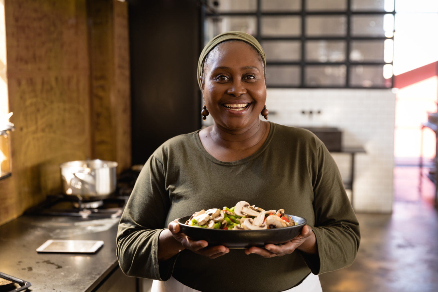 African woman showing her dish