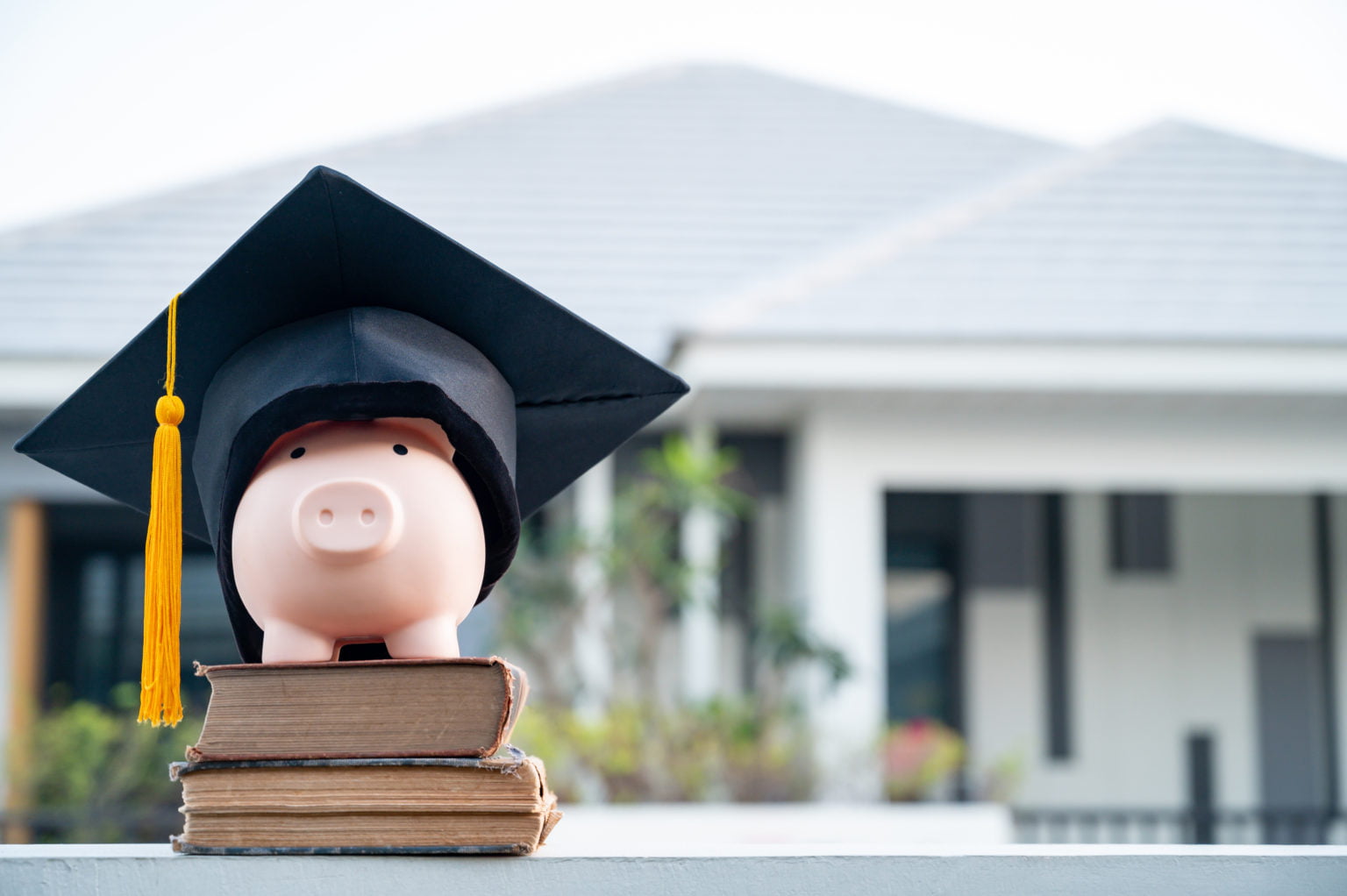 piggy bank and graduation cap University level. Concept of saving money for education.