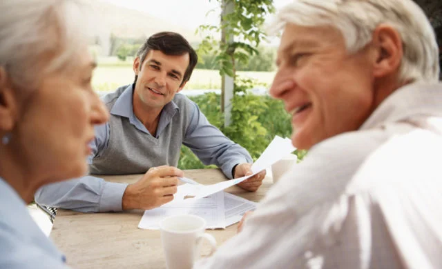 older couple with advisor discussing finances