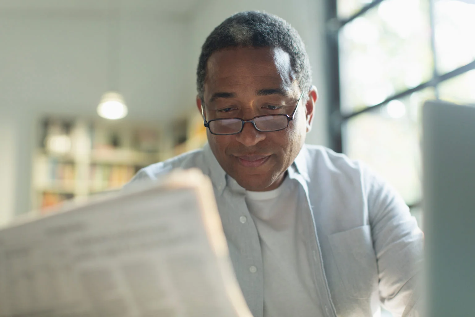 Senior man reading newspaper