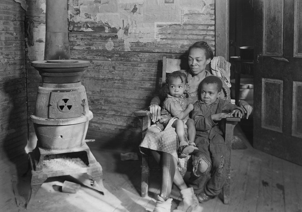 Mother with children in a rocking chair during the Great Depression