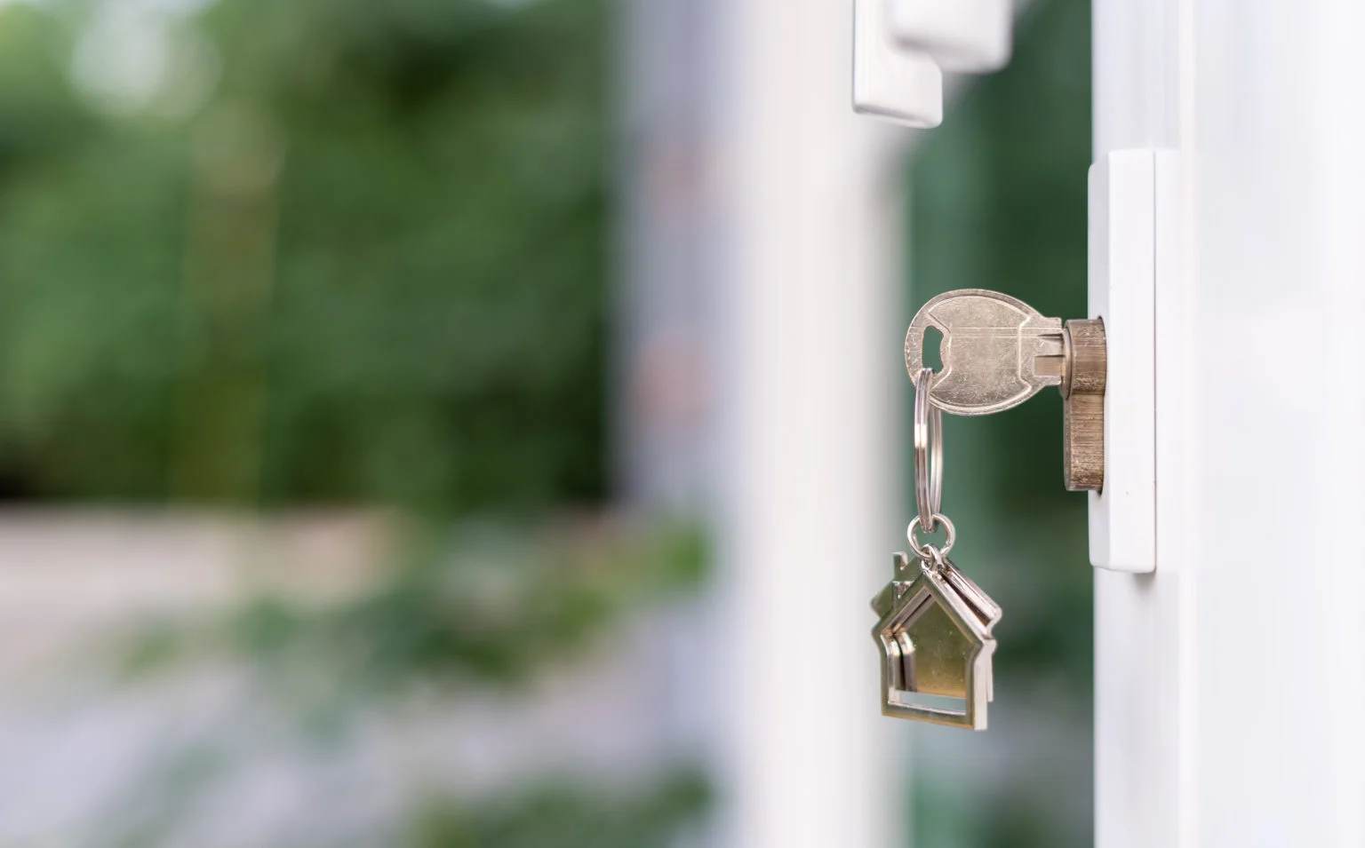 Key in door lock with. a house keychain