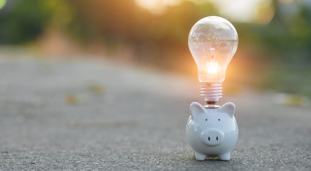 lightbulb above a piggy bank