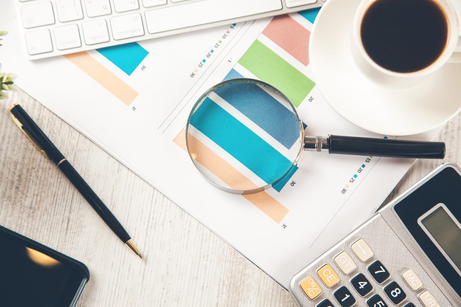 magnifier on graph on working desk