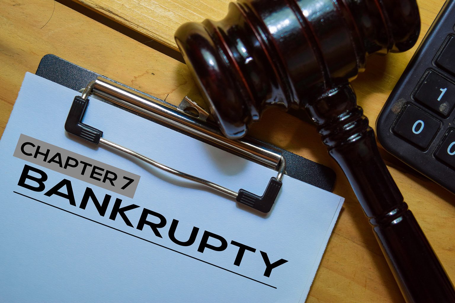 Bankcrupty Chapter 7 text on Document form and Gavel isolated on office desk