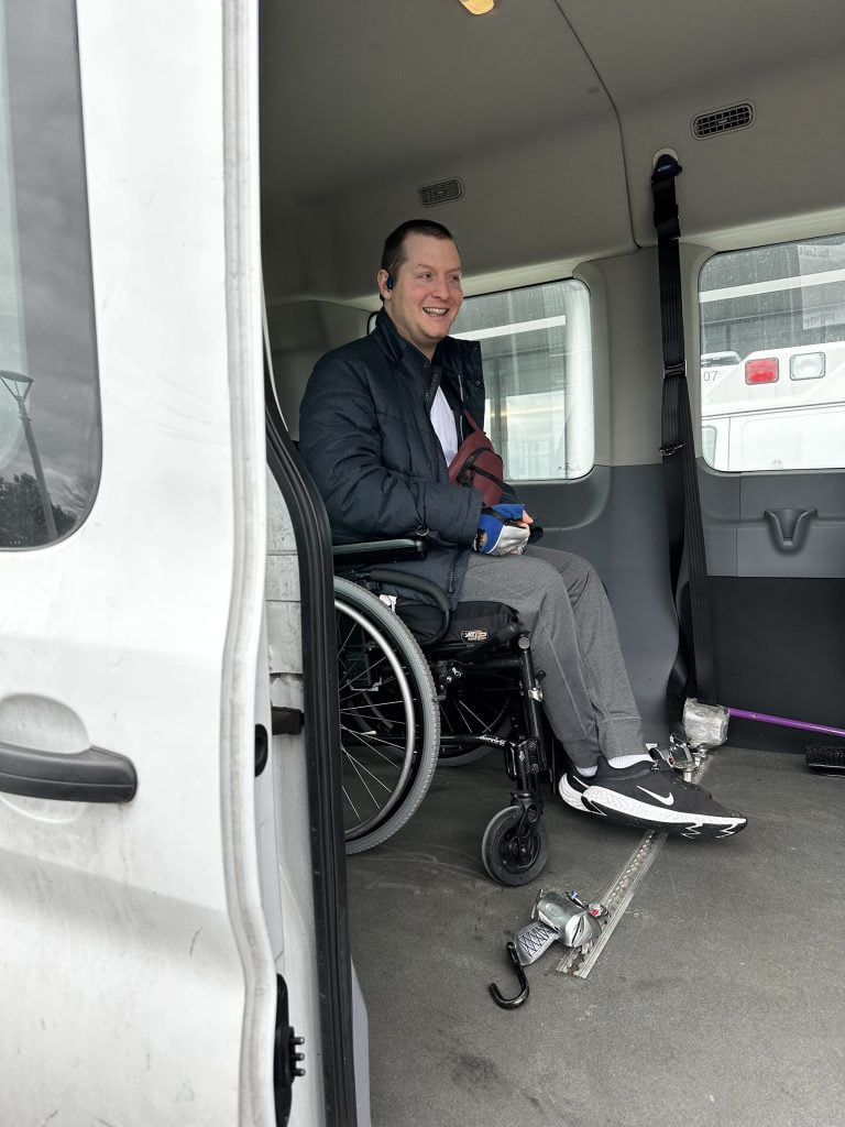 Jake Haendel in a wheelchair accessible van