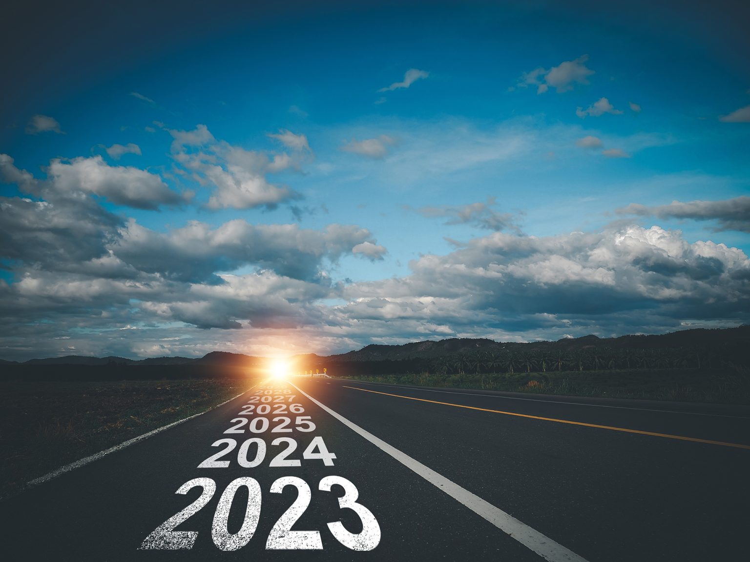 Road with written years going off into the horizon, beginning with 2023