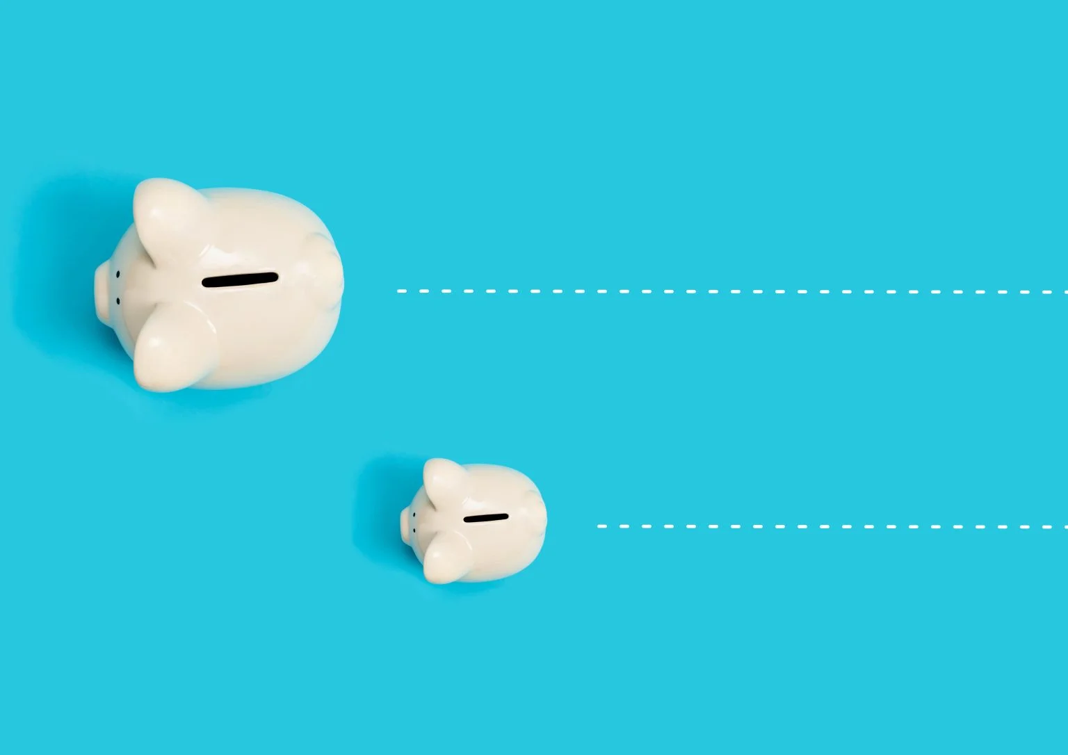 Big and small piggy banks on a blue background