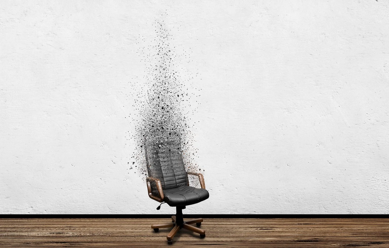 Black leather armchair disinegrating in room