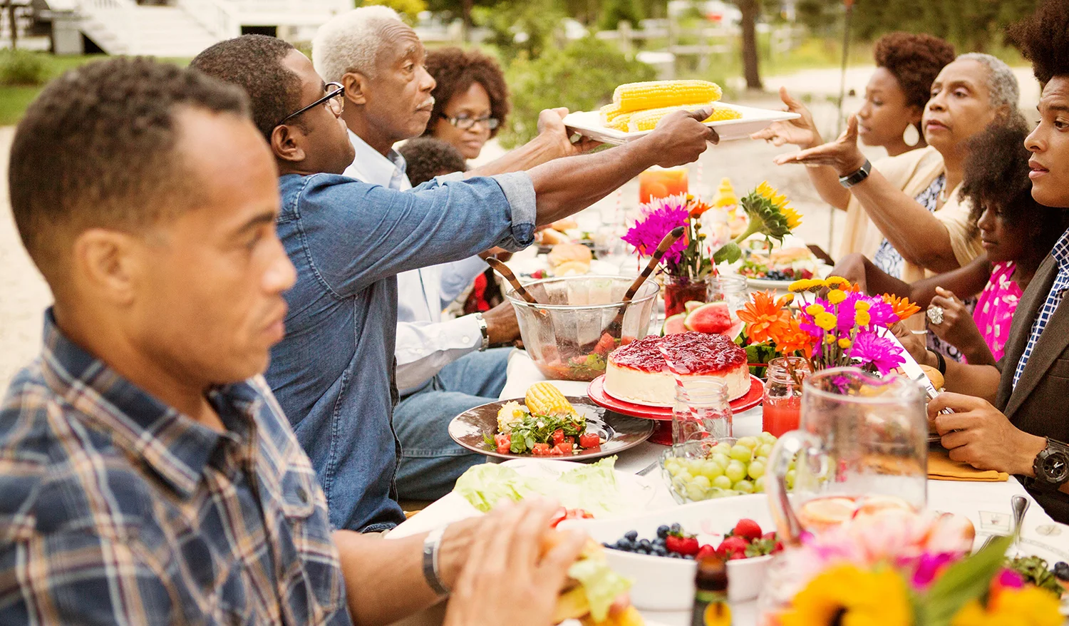 Large family eating dinner outdoors