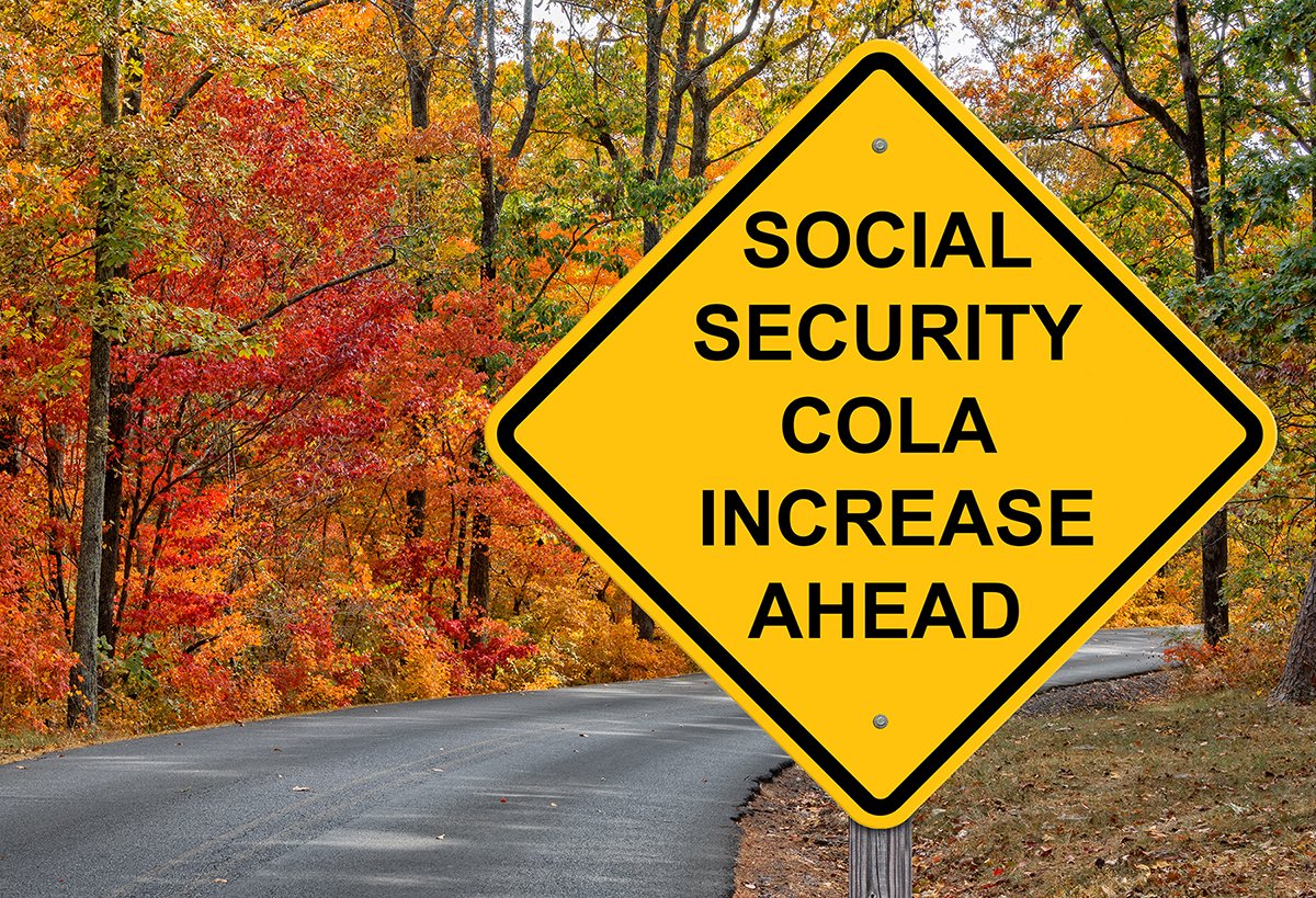 Yield sign on a road with fall foliage that says Social Security COLA increase ahead