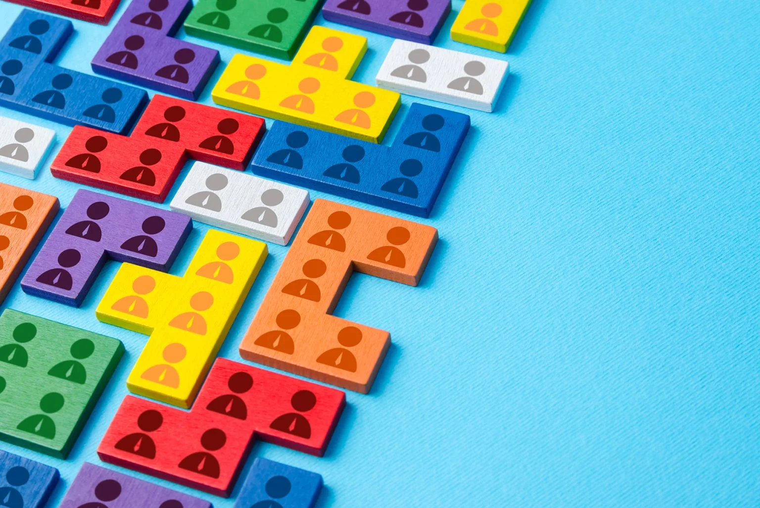 Worker icons on different colored blocks