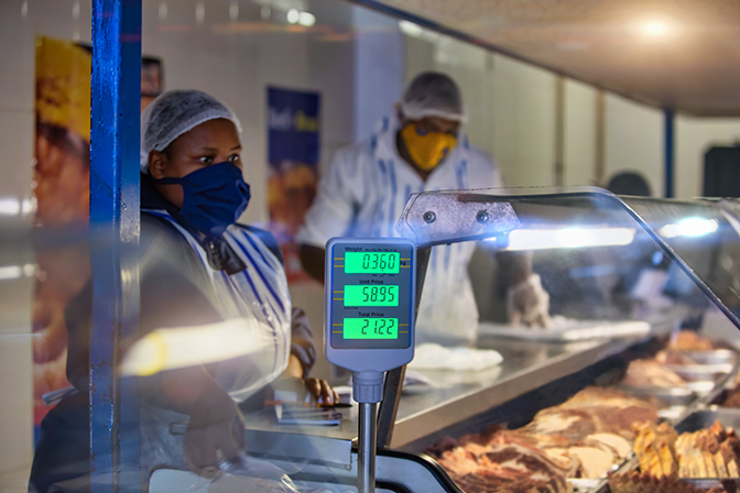 Working at a butchery shop stock photo