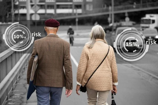 Back view of two older people walking down the street with risk indicator graphics on either side