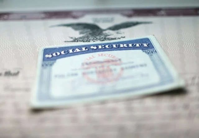 Social Security card on top of financial document