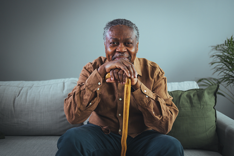 Older African-American man sitting on a couch