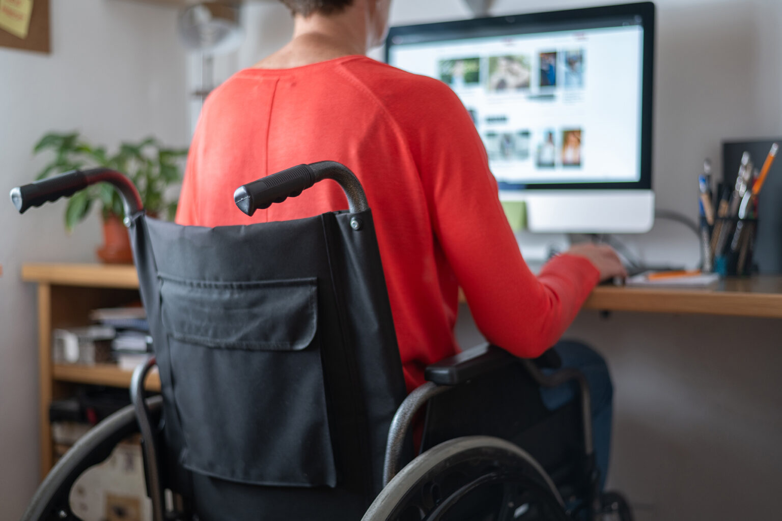 Person With Disability Working From Home On A Laptop