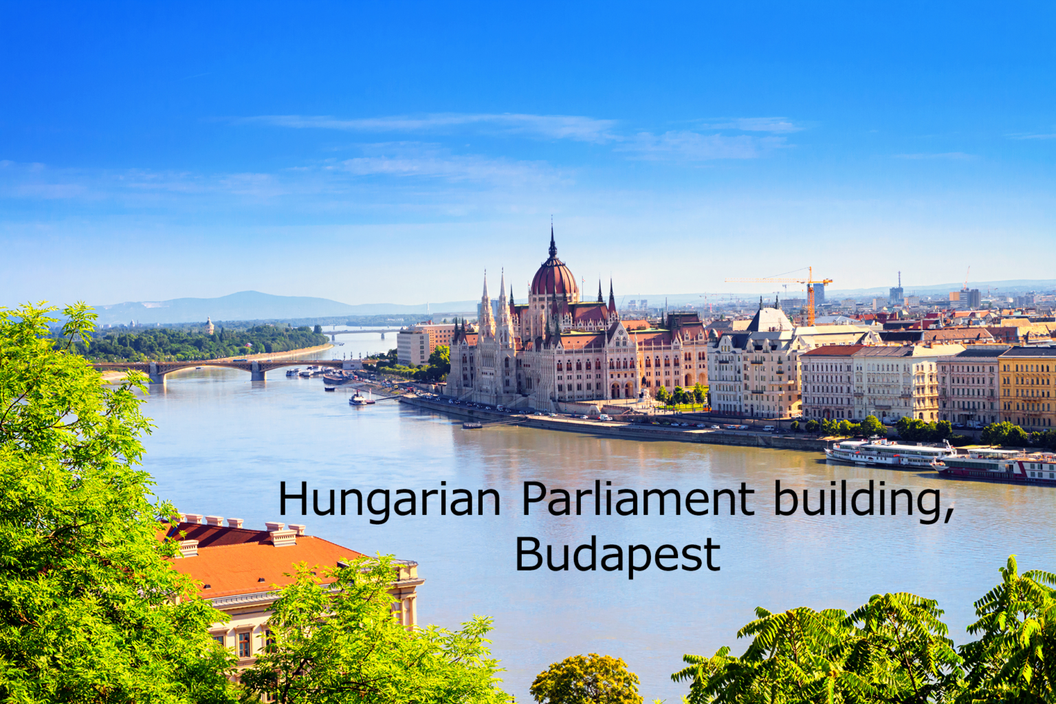 view of the Hungarian Parliament Building and Danube river in the historical center of Budapest