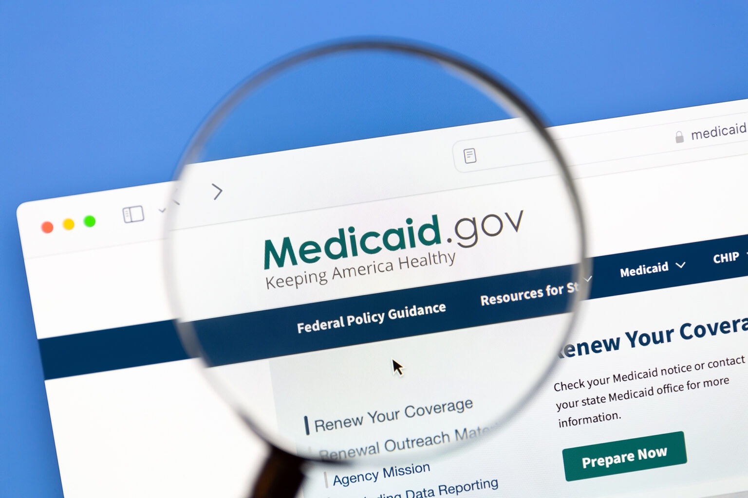 Magnifying glass over the Medicaid.gov webpage