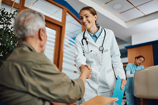 Doctor shaking patients hands