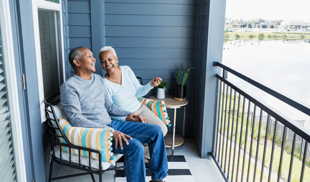 A couple sitting on a porch