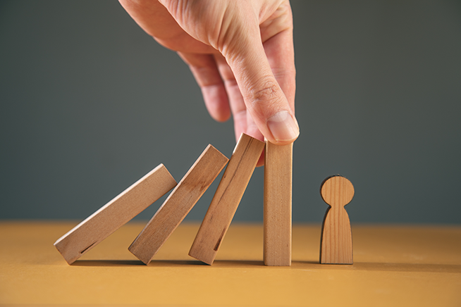 Wooden blocks knocking into a man