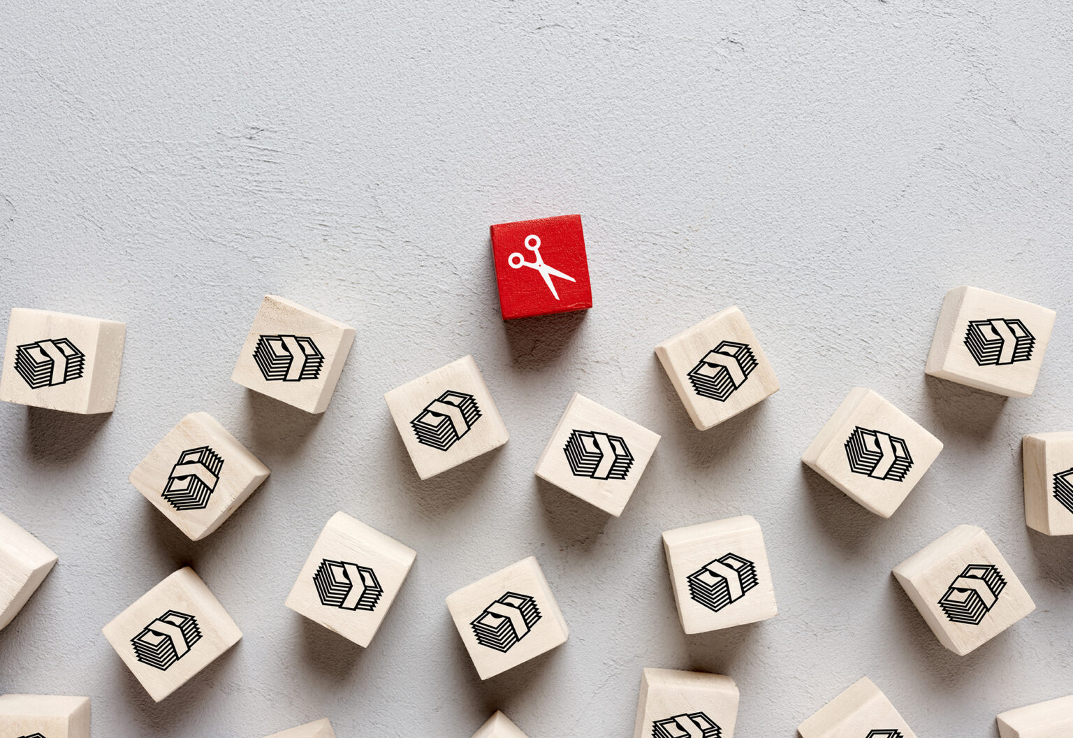 Scissors and money icons on wooden cubes