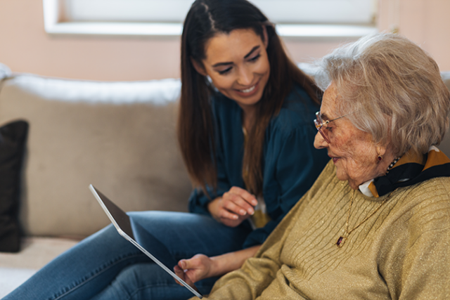 Mother and daughter looking at health insurance options